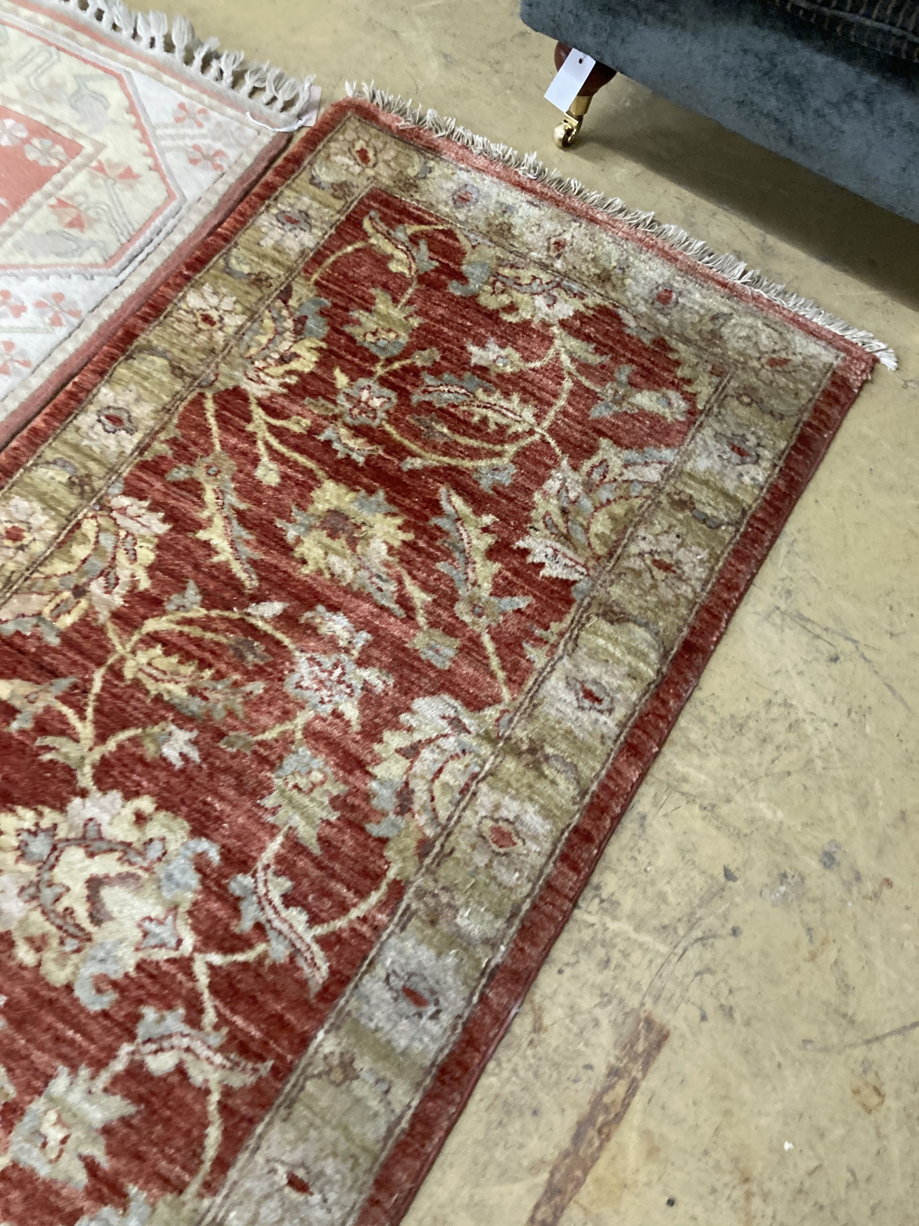 An Afghan Ziegler peach ground runner and another runner, largest 310 x 84cm